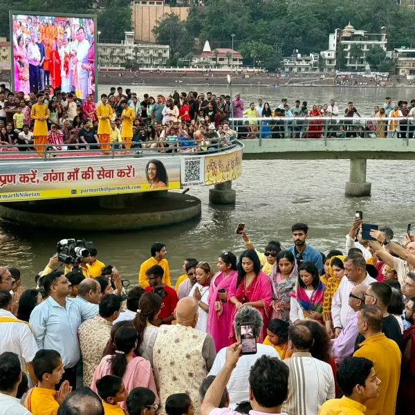 Crowd on the riverside ghat in Rishikesh during the Ganga Aarti ceremony