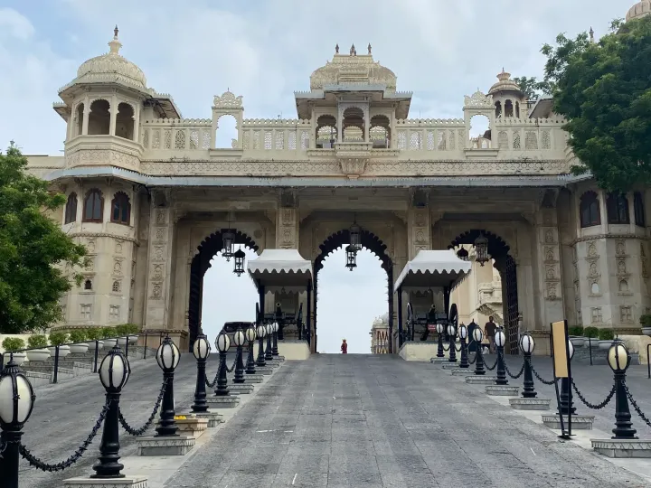 The ceremonial gateway of the City Palace in Udaipur with cannons and lamp posts
